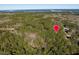 Aerial view of wooded lot with large trees and surrounding landscape at 63 Pennington Cir, Chapel Hill, NC 27517