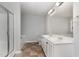 Bathroom with a double sink vanity, large mirror, shower stall, and tile flooring at 709 Conifer Ct, Creedmoor, NC 27522