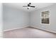 Cozy bedroom with natural light from window and a ceiling fan at 709 Conifer Ct, Creedmoor, NC 27522