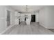 Modern kitchen featuring white cabinets, stainless steel appliances, quartz countertops, and an island perfect for entertaining at 709 Conifer Ct, Creedmoor, NC 27522