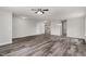 Bright living room with wood-look floors and neutral paint at 709 Conifer Ct, Creedmoor, NC 27522