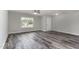 Living area with natural light and wood-look flooring at 709 Conifer Ct, Creedmoor, NC 27522
