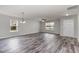 Well-lit living room featuring wood-look floors and a ceiling fan at 709 Conifer Ct, Creedmoor, NC 27522
