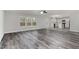 Open living area with views to the kitchen and outdoor access at 709 Conifer Ct, Creedmoor, NC 27522