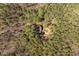 Expansive aerial view of home nestled in a dense forest at 735 Jordan Hills Loop, Chapel Hill, NC 27517