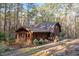 Two-story house featuring wood cladding, skylights, and a charming front porch at 735 Jordan Hills Loop, Chapel Hill, NC 27517