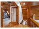 Hallway featuring hardwood floors, wood ceilings and a glass door at 735 Jordan Hills Loop, Chapel Hill, NC 27517