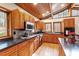 Bright kitchen featuring wood ceiling, granite countertops, tiled backsplash, hardwood floors and stainless steel appliances at 735 Jordan Hills Loop, Chapel Hill, NC 27517