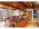 Kitchen and dining area with hardwood floors, granite countertops, breakfast bar, stainless appliances and beautiful wooded views at 735 Jordan Hills Loop, Chapel Hill, NC 27517