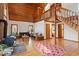 Open concept living area with wood ceiling, hardwood floors, brick fireplace and staircase to the second level at 735 Jordan Hills Loop, Chapel Hill, NC 27517