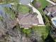 Aerial view of a home surrounded by lush greenery and trees at 7504 Everton Way, Wake Forest, NC 27587
