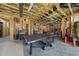 Unfinished basement with ping pong table, exposed ceiling, with potential for recreation or storage space at 7504 Everton Way, Wake Forest, NC 27587