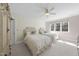 This bedroom features two beds, carpeted floors, a ceiling fan and a large window at 7504 Everton Way, Wake Forest, NC 27587