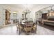 Dining room with round table, chandelier, and access to outdoor patio at 7504 Everton Way, Wake Forest, NC 27587
