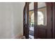 View from inside looking out through arched front doors and stone entry way at 7504 Everton Way, Wake Forest, NC 27587