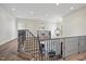 Beautiful foyer with wrought iron staircase railing and a decorative chandelier at 7504 Everton Way, Wake Forest, NC 27587
