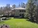 Two story house showcasing stone and siding with a manicured lawn and garden at 7504 Everton Way, Wake Forest, NC 27587