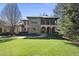 Two story house showcasing stone and siding with a manicured lawn and garden at 7504 Everton Way, Wake Forest, NC 27587