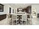 An impressive granite island with barstool seating provides ample space for dining and socializing at 7504 Everton Way, Wake Forest, NC 27587