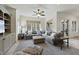 Bright living room with large windows, comfortable sofa, and neutral decor at 7504 Everton Way, Wake Forest, NC 27587