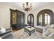 Cozy living room with elegant decor, dark wood accents, and arched doorways at 7504 Everton Way, Wake Forest, NC 27587
