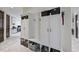 Well-organized mudroom with custom built-in cabinets, storage baskets, and a convenient bench at 7504 Everton Way, Wake Forest, NC 27587