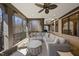 Inviting outdoor living space featuring wicker seating, stone floors, and a beautiful view of the woods at 7504 Everton Way, Wake Forest, NC 27587