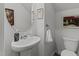 Charming powder room features stylish pedestal sink, elegant mirror, and convenient toilet creating a functional space at 80 Westbrook Ln, Franklinton, NC 27525