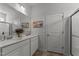 Bathroom featuring double sinks, granite countertops, large mirror, and decor at 80 Westbrook Ln, Franklinton, NC 27525