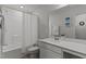White bathroom with a bath tub, large mirror and a single vanity at 80 Westbrook Ln, Franklinton, NC 27525