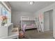 Well-lit bedroom includes white bunk beds, a desk area, and carpet floors at 80 Westbrook Ln, Franklinton, NC 27525