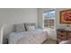 Bedroom with a single bed by a window, offering a peaceful and serene atmosphere at 80 Westbrook Ln, Franklinton, NC 27525