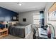 Charming bedroom featuring a piano, work space, and a large window for plenty of natural light at 80 Westbrook Ln, Franklinton, NC 27525