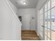 Bright entryway featuring a staircase, wood-look floors, and a door leading to the outside at 80 Westbrook Ln, Franklinton, NC 27525