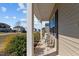 Comfortable front porch setting with two chairs offering a peaceful outdoor space at 80 Westbrook Ln, Franklinton, NC 27525