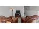 Cozy living room with plush leather armchairs and a dark wood TV stand at 80 Westbrook Ln, Franklinton, NC 27525