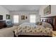 Bright Primary bedroom featuring a large bed, stylish decor, and soft carpet creating a comfortable sanctuary at 80 Westbrook Ln, Franklinton, NC 27525