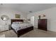 Vaulted ceiling Primary bedroom with large bed, dresser, and soft carpet provides a tranquil escape at 80 Westbrook Ln, Franklinton, NC 27525