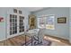 Well-lit office featuring a large window, a modern desk setup, and stylish decorative elements at 80 Westbrook Ln, Franklinton, NC 27525