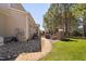 Backyard featuring a stone fireplace and brick pathway, perfect for outdoor gatherings at 804 Cambridge Hall Loop, Apex, NC 27539