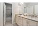 Bright bathroom with double sinks and a large mirror above a neutral-toned vanity at 804 Cambridge Hall Loop, Apex, NC 27539