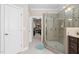 This bathroom boasts a glass-enclosed shower and an entrance to a walk-in closet at 804 Cambridge Hall Loop, Apex, NC 27539
