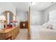 Serene bedroom with a vanity, matching nightstand, and comfortable-looking bed at 804 Cambridge Hall Loop, Apex, NC 27539