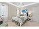 Comfortable bedroom with large window, ceiling fan, and coordinated bedding at 804 Cambridge Hall Loop, Apex, NC 27539