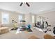 Spacious exercise room featuring lots of natural light, multiple machines, and additional workout equipment at 804 Cambridge Hall Loop, Apex, NC 27539