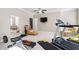 Fully equipped home gym provides a comfortable space to exercise; includes treadmill and weight machines at 804 Cambridge Hall Loop, Apex, NC 27539