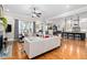 Open concept living room and kitchen with hardwood floors and natural light at 804 Cambridge Hall Loop, Apex, NC 27539