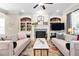 Inviting living room features a fireplace, built-in bookshelves and stylish decor at 804 Cambridge Hall Loop, Apex, NC 27539