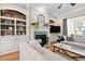 Cozy living room with fireplace, built-ins, and elegant furnishings at 804 Cambridge Hall Loop, Apex, NC 27539