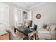 Functional office space with a modern desk setup, cozy chair, and natural light at 804 Cambridge Hall Loop, Apex, NC 27539